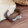 Irregular wide resin bangle with a vintage amber marbled pattern in chic Maillard brown style - Gray