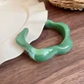 Retro green irregular wavy resin cuff bracelet featuring a glossy marble-like finish - Dark Green