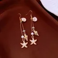 Bohemian gold ocean drop earrings featuring starfish, conch shell charms and pearls - Earring Hooks / Gold, White