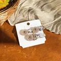 Detailed view of elegant resin flower hair clips with bow and rhinestone accents - Pink (Pair) / Silver