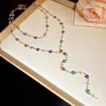 Close-up of elegant silver Y-necklace featuring colorful enamel butterflies and daisies. - Silver - Rainbow