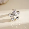 Close-up detail of a sparkling crystal flower open ring with rhinestone petals - Flower Open Ring / Silver (White)