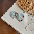 Light blue enamel flower hoop earrings with zircons for a sweet and elegant style - Silver Base Flower Ear Buckle / Blue