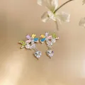 Close-up of sweet colorful flower heart earrings with cubic zirconia and pearls - Colorful