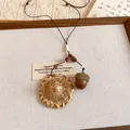 Detail of unique woven hat and acorn pendants on a rustic brown cord necklace. - Rattan Round Hat Style (3#)