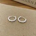 Minimalist Korean style silver hoop earrings with unique scalloped edge texture detail. - Round Scalloped Style / Silver