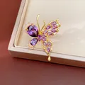 Elegant gold plated purple zircon butterfly jewelry piece displayed on a beige tray - Ring / Purple