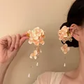 Elegant peach fabric flower hair clip with delicate pearl tassel fringe for women - Orange Duckbill Clip