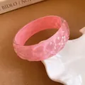 Close-up view of the iridescent pink resin bangle featuring unique pleated texture details - No. 6 Bangle - Iridescent Pink