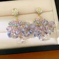 Close-up of elegant vintage-style fan-shaped tassel earrings with purple crystals in a box - Fan Tassel Style (HE34234) / Blue-Purple