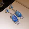 Detailed view of luxury oval blue stone earrings with pearl and crystal beads - Earrings (Silver Earring Post) / Silver-Blue
