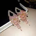 Elegant silver post earrings with pink crystal tassels and geometric zircon detail - Pink