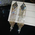 Close-up of silver needle diamond tassel earrings with sparkling crystal rhinestones. - Black Rhombus Rhinestone Tassel Style (1#)