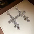 Close-up of sparkling rhinestone cross-shaped drop earrings on cream jewelry tray - Cross Rhinestone Style (5#)