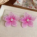 Elegant pink mesh flower stud earrings featuring a central white pearl detail for women - Flower Style / Purple