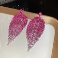 Close-up detail of fuchsia rhinestone fringe earrings showcasing sparkling tiered leaf design. - Leaf Rhombus Tassel Style (20#)