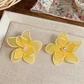 Elegant vacation style yellow mesh flower stud earrings with white pearl accents - Flower Style / Yellow