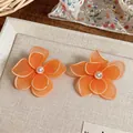 Handmade orange mesh flower stud earrings with pearl center in sweet vacation style - Flower Style / Orange