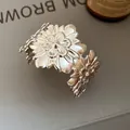 Detailed macro view of the layered silver floral patterns on the metal cuff bracelet. - Multi-Layer Pleated Flower Style / Silver