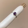 Close-up detail of a minimalist silver open ring featuring a purple cushion-cut stone - Square Open Ring (HR3582) / Purple