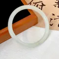 Macro view of a translucent jade-like glass bangle on a traditional background - Beige (Style 14)