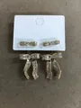 18k gold plated zircon bow pendant earrings on white display card - Gold