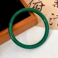 Detailed macro view of an emerald green jade-style round glass bangle for Hanfu accessories - Green (Style 4)