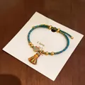 Handgefertigtes buntes geflochtenes Armband mit traditionellem Quasten-Anhänger zum Drachenbootfest - Friedensschloss Anhänger