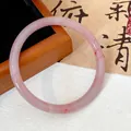 Detailed close-up of a pink marbled glass bangle with elegant red textures and shine - Pink (Style 21)