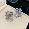 Detail view of floral zircon earrings featuring colorful oval gemstones and silver needles. - Flower Pendant Style (HE34193) / Silver - Pink Yellow Green Color