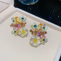 Detailed macro view of floral stud earrings with colorful gemstones and clear zircon - Flower Pendant Style (HE34193) / Gold - Pink Green Yellow Color