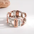 Detailansicht eines zweifarbigen elastischen Metallarmbands mit Inspire-Gravuren - Silber+Roségold