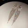 Long sparkling rhinestone tassel earrings with silver needle, elegant vintage design. - Circular Hollow Tassel Style (84#)