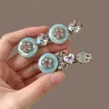 Detail of elegant blue floral hair clips with sparkling heart-shaped rhinestones. - Duckbill Hair Clips / Blue