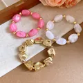 Irregular geometric acrylic elastic bracelets with vintage gold-tone beads detail - Irregular Beaded Bracelet Set / Gold-Pink-Transparent