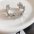 Silver wrinkled flower metal cuff bracelet for women with elegant textured petals design - Daisy Pattern Pleated Style / Silver