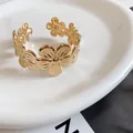 Elegant gold-tone metal cuff bracelet featuring detailed and textured floral motifs - Stamen Sphere Pleated Style / Gold