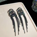 Elegant black rhinestone tassel earrings with interlocked circular design in black - Triple Overlapping Ring Tassel Style (41#)