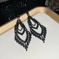 Elegant black diamond rhomboid tassel earrings displayed on a luxury white and gold tray. - Multi-layer Nested Rhombus Tassel Style (56#)