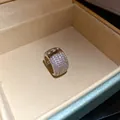 Macro view of zircon-encrusted silver ear cuff in jewelry box - Pave Rhinestone Style (HE32237) / Silver