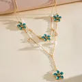 Detail of a double-layered gold necklace with blue enamel flowers and pearls - Stacked Set / Gold-Blue