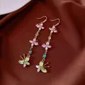 Elegant long dangle earrings with colorful butterfly and floral zircon crystals. - Style 21