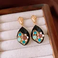 Vintage black teardrop earrings featuring intricate zircon flower motifs in gold - Style 28