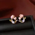 Elegant pink flower stud earrings with zircon and pearls on black leather texture - Style 36