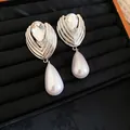 Close-up of French-style silver earrings with faceted crystal and teardrop pearls - Silver Needle Waterdrop Pearl Style / Silver