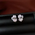 Silver flower stud earrings with faceted zircon crystals in a black jewelry box - Style 39
