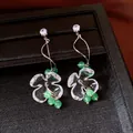Elegant silver needle flower earrings featuring sparkling zircon studs and green beads - Style 42