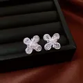 Shimmering silver flower stud earrings with clear zircon stones for a sweet vacation style - Style 54