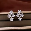 Elegant flower stud earrings with sparkling cubic zirconia and silver needles - Style 56