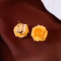 Elegant yellow rose flower stud earrings with comfortable gold-plated clip-on backs. - Style 58